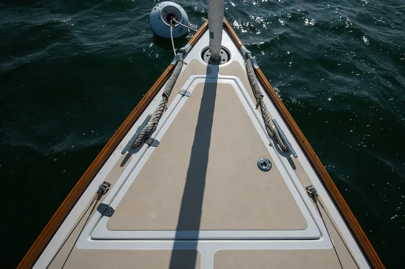 Slide: The Image of Bow of 2006 Morris M36 Daysailer on water, featuring deck details and mooring line. - 20