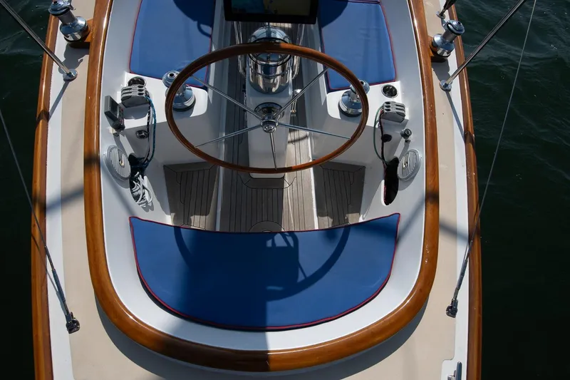 Slide: The Image of 2006 Morris M36 Daysailer cockpit with wooden accents and blue seating. - 26