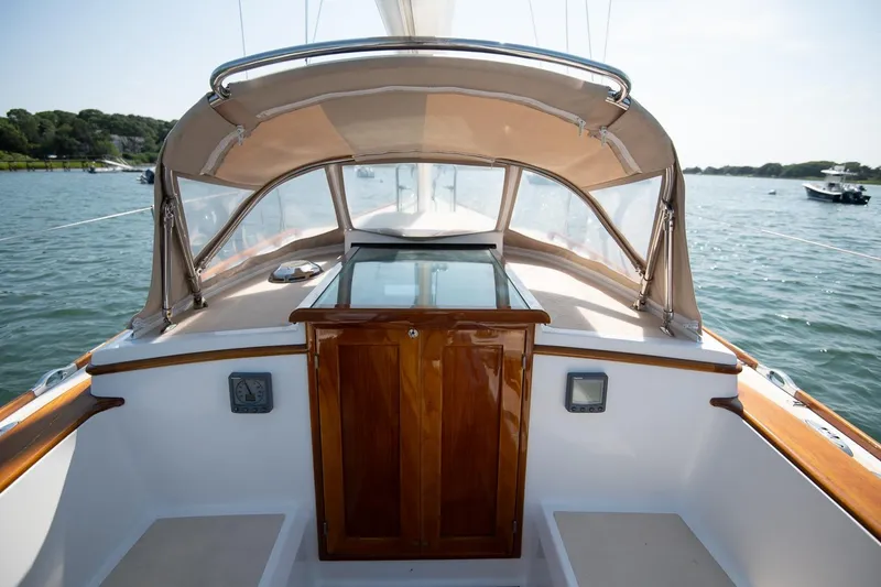 Slide: The Image of 2006 Morris M36 Daysailer cockpit with wooden details and canopy on calm water. - 30