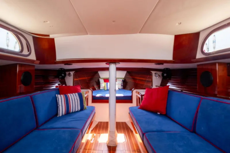 Slide: The Image of Interior of 2006 Morris M36 Daysailer with blue seating and wooden accents. - 35