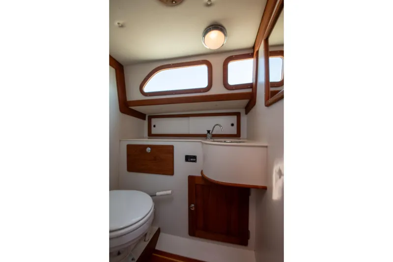 Slide: The Image of Interior of 2006 Morris M36 Daysailer bathroom with wooden accents and compact design. - 41