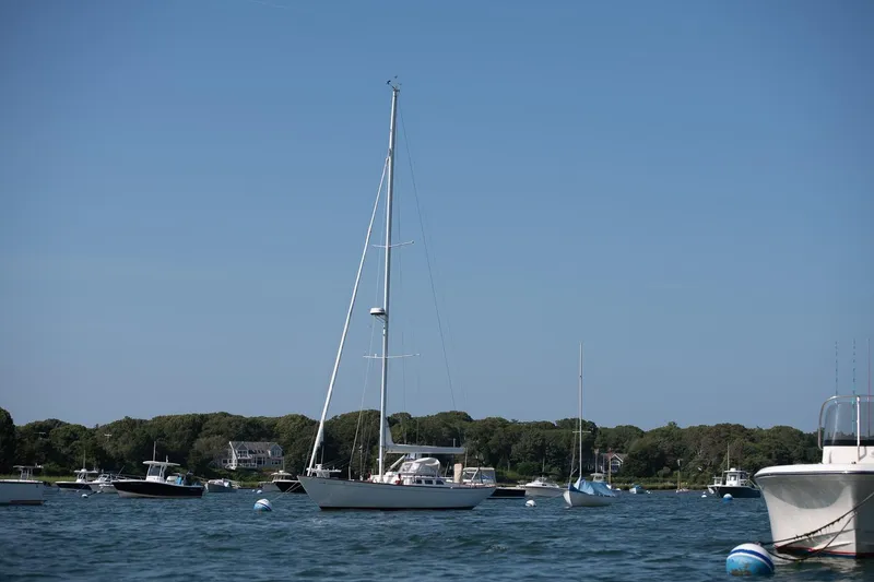 Slide: The Image of 2006 Morris M36 Daysailer anchored in a scenic harbor with other boats. - 8