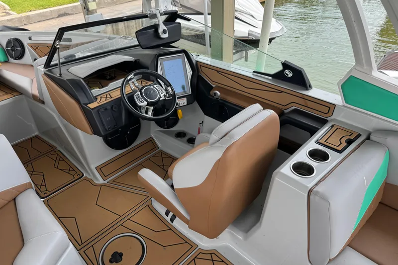 Slide: The Image of 2022 Tigé Z3 boat interior with modern dashboard and stylish seating. - 9