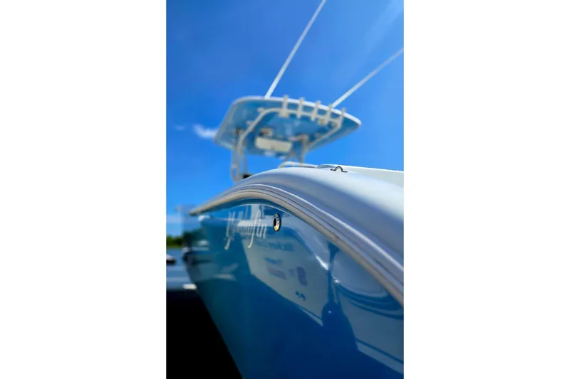 Slide: The Image of 2007 Yellowfin 36 boat against clear blue sky, showcasing sleek design. - 6