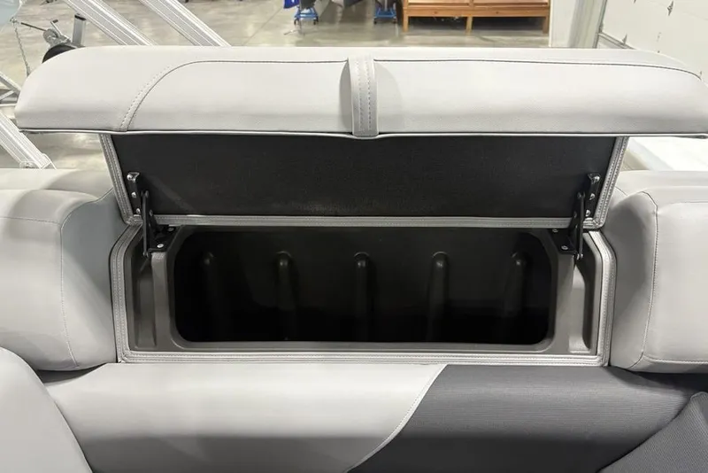 Slide: The Image of Battery compartment of 2026 Sun Tracker SportFish 20 DLX boat, featuring wiring and secure storage. - 12