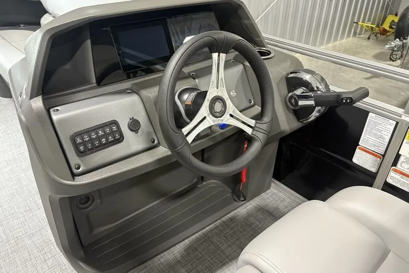 Slide: The Image of 2026 Sun Tracker SportFish 20 DLX boat seating, featuring sleek gray upholstery and modern design. - 20