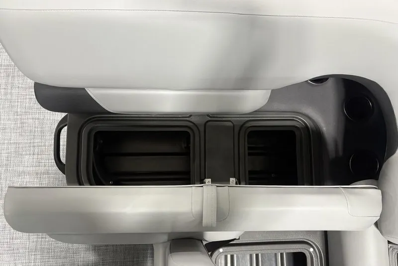 Slide: The Image of Storage compartment in 2026 Sun Tracker SportFish 20 DLX boat with safety equipment. - 21