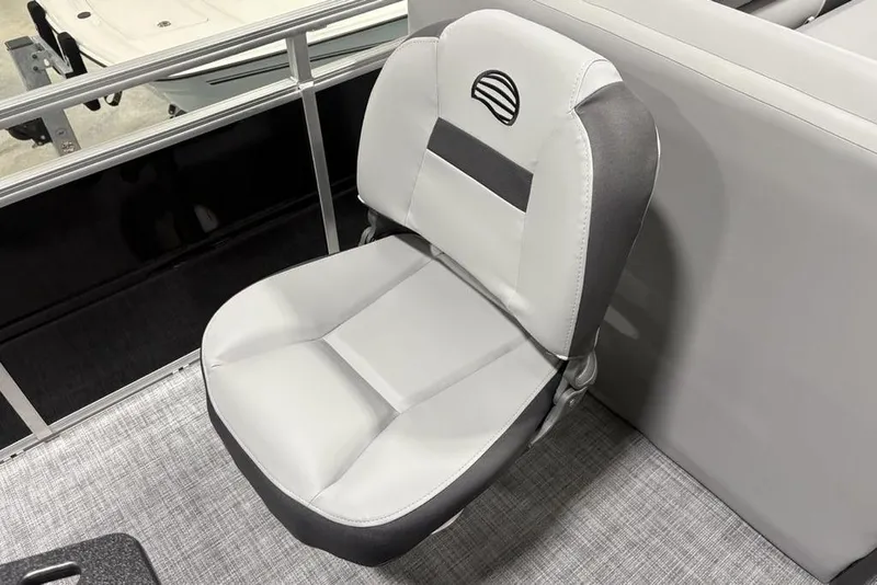 Slide: The Image of 2026 Sun Tracker SportFish 20 DLX boat seat storage compartment open, showcasing interior space. - 24