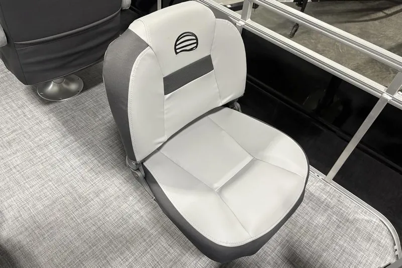 Slide: The Image of 2026 Sun Tracker SportFish 20 DLX pontoon boat interior with seating and helm. - 27