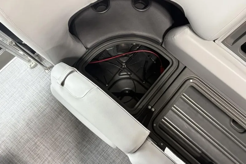 Slide: The Image of Luxurious seating on 2026 Sun Tracker SportFish 20 DLX pontoon boat, featuring cup holders and speaker. - 6