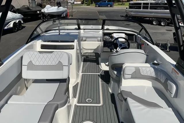 Slide: The Image of 2025 Bayliner VR6 Bowrider I/O interior with sleek seating and modern dashboard design. - 10