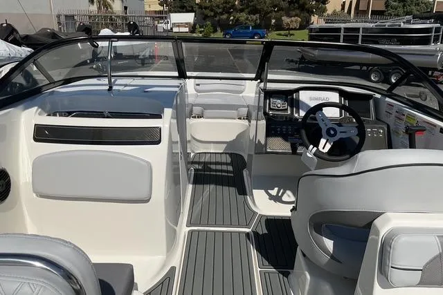 Slide: The Image of 2025 Bayliner VR6 Bowrider I/O interior with modern dashboard and seating. - 12