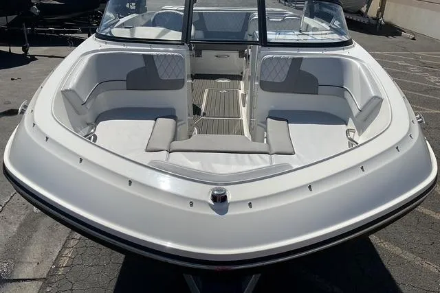 Slide: The Image of 2025 Bayliner VR6 Bowrider I/O boat with spacious seating and sleek design. - 13