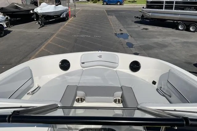 Slide: The Image of 2025 Bayliner VR6 Bowrider I/O boat interior with seating and cup holders. - 14