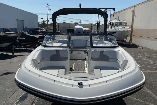 Slide: The Image of 2025 Bayliner VR6 Bowrider I/O boat, front view, parked outdoors. - 17