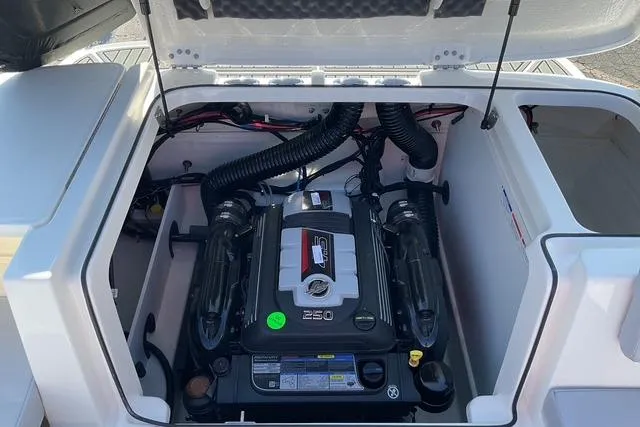 Slide: The Image of 2025 Bayliner VR6 Bowrider I/O engine compartment with visible components and wiring. - 18