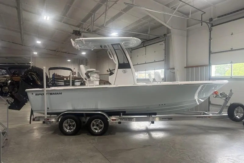 The Image of 2026 Sportsman Masters 227 boat on trailer in indoor storage facility. - 1