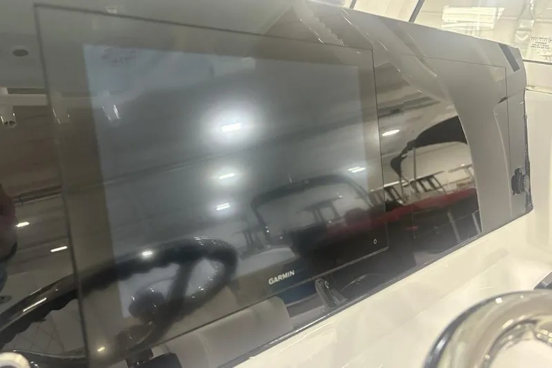 Slide: The Image of Dashboard of 2026 Sportsman Masters 227 boat with Garmin display. - 16