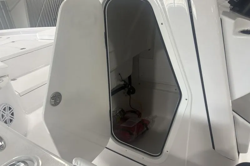 Slide: The Image of Open storage compartment on 2026 Sportsman Masters 227 boat, showcasing interior space. - 20