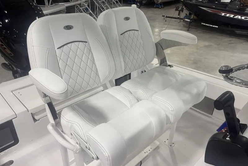 Slide: The Image of 2026 Sportsman Masters 227 boat seats with white upholstery and diamond stitching. - 21