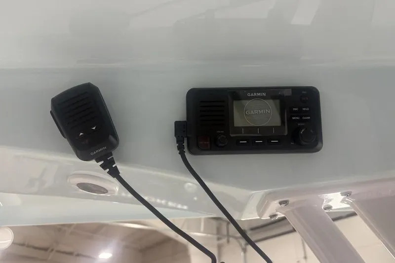 Slide: The Image of Garmin marine radio and microphone on 2026 Sportsman Masters 227 boat. - 23