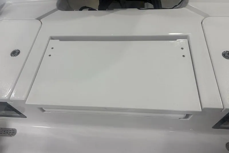 Slide: The Image of 2026 Sportsman Masters 227 Bay Boat deck with storage compartment. - 29