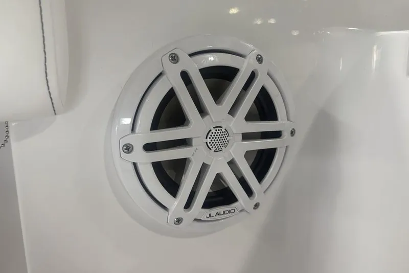 Slide: The Image of White JL Audio speaker on a 2026 Sportsman Masters 227 boat. - 34