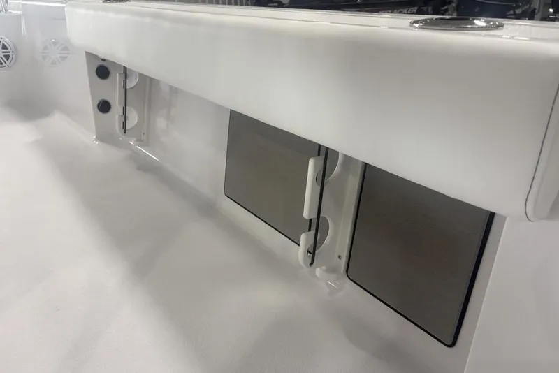 Slide: The Image of 2026 Sportsman Masters 227 boat interior with storage compartments and speakers. - 35