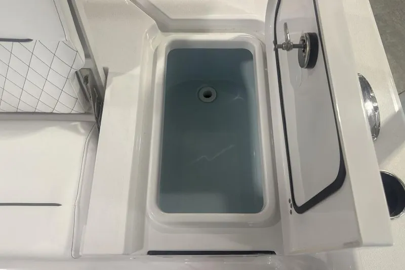 Slide: The Image of Livewell compartment in 2026 Sportsman Masters 227 boat, featuring a sleek design. - 39