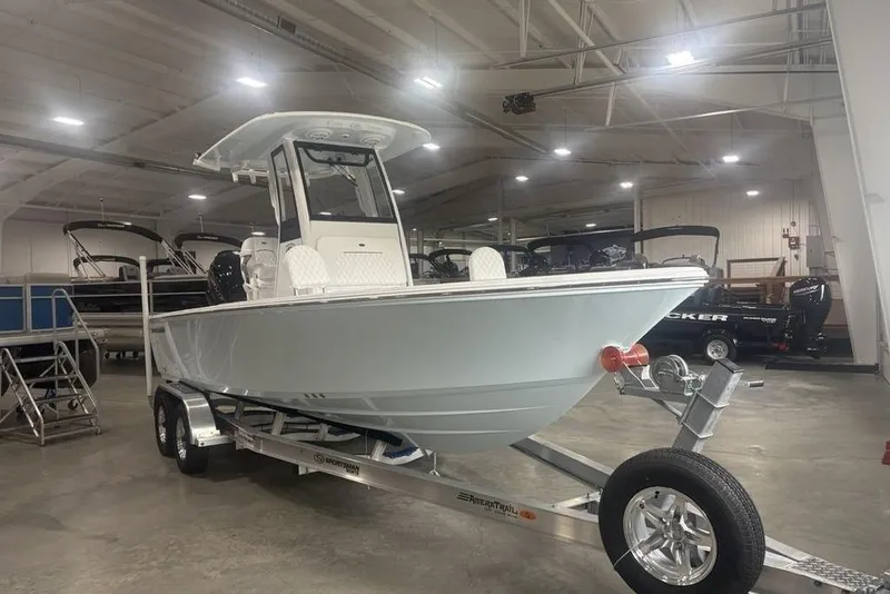 Slide: The Image of 2026 Sportsman Masters 227 boat on trailer in indoor showroom. - 5