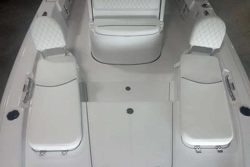 Slide: The Image of 2026 Sportsman Masters 227 boat interior with white cushioned seating and sleek design. - 7