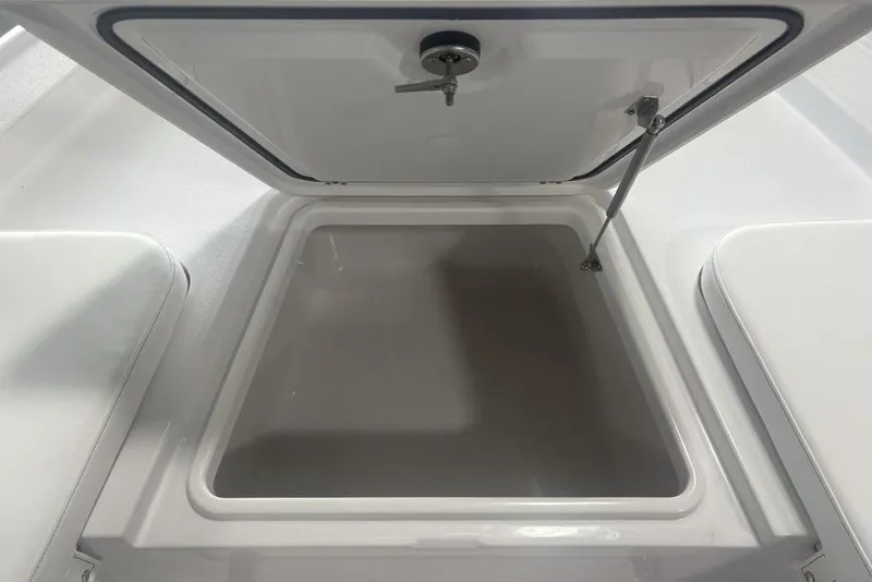 Slide: The Image of Open storage compartment in 2026 Sportsman Masters 227 boat. - 8
