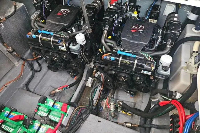 Slide: The Image of Engine compartment of a 2004 Sea Ray 300 Sundancer with twin MerCruiser 5.0 engines. - 27