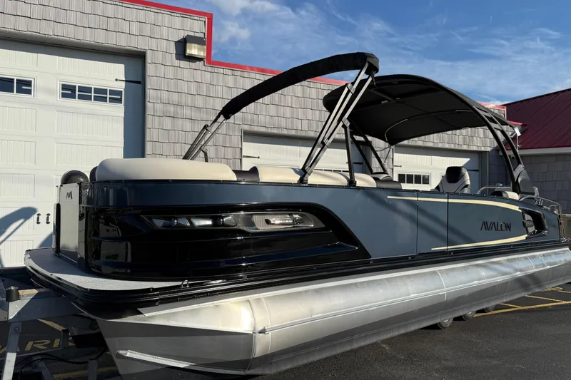 Slide: The Image of 2025 Avalon 2785 Excalibur LTD Tri Toon boat with Mercury 400hp V-10 engine. - 1