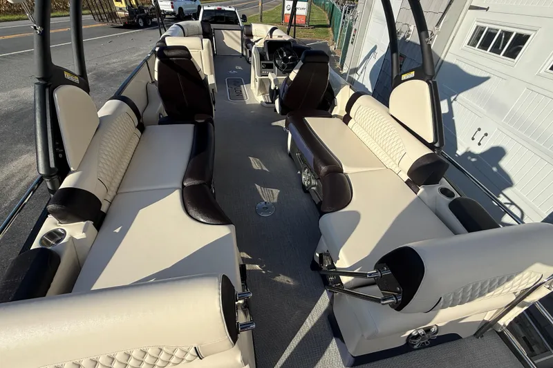 Slide: The Image of 2025 Avalon 2785 Excalibur LTD boat interior with luxurious seating and modern design. - 13