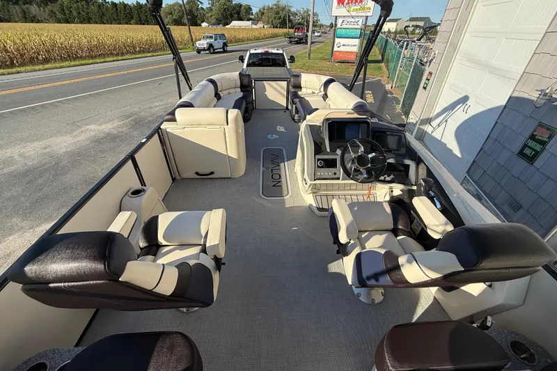 Slide: The Image of 2025 Avalon 2785 Excalibur LTD boat interior with luxurious seating and advanced controls. - 14