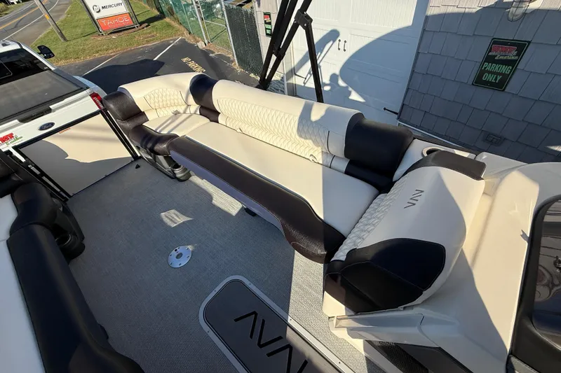 Slide: The Image of Luxurious seating on 2025 Avalon 2785 Excalibur LTD Tri Toon boat, featuring premium upholstery. - 17