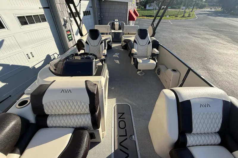 Slide: The Image of 2025 Avalon 2785 Excalibur LTD boat interior with luxurious seating and high-performance features. - 19