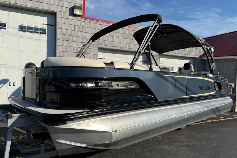 Slide: The Image of 2025 Avalon 2785 Excalibur LTD Tri Toon boat with Mercury 400hp V-10 engine. - 2