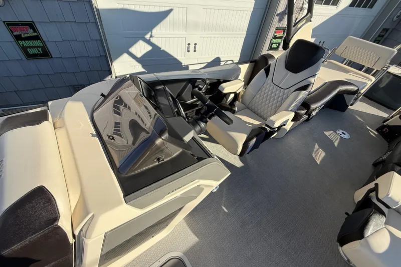 Slide: The Image of 2025 Avalon 2785 Excalibur LTD boat interior with luxury seating and high-performance features. - 20