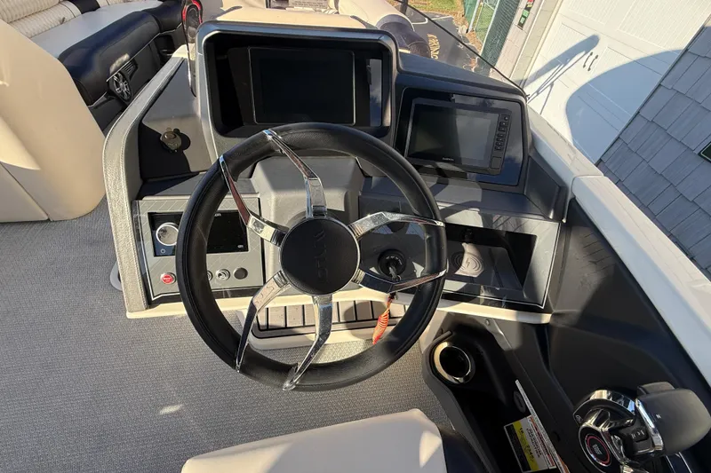Slide: The Image of Steering console of 2025 Avalon 2785 Excalibur LTD, featuring advanced controls and displays. - 27