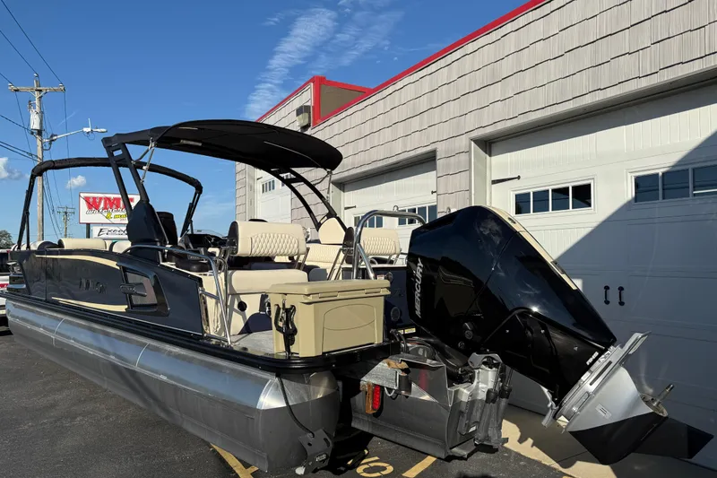 Slide: The Image of 2025 Avalon 2785 Excalibur LTD Tri Toon with Mercury 400hp V-10 engine, parked outdoors. - 6