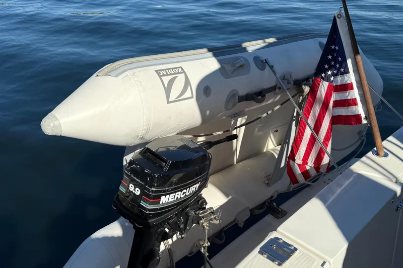 Slide: The Image of 1999 Bayliner 3788 Command Bridge Motoryacht with Zodiac inflatable and Mercury outboard. - 21