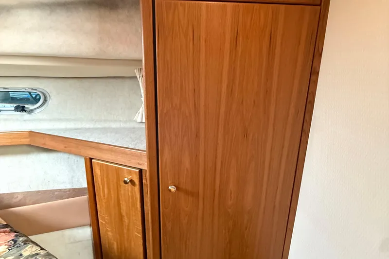 Slide: The Image of Interior of 1999 Bayliner 3788 Command Bridge Motoryacht with wooden cabinetry and window. - 41