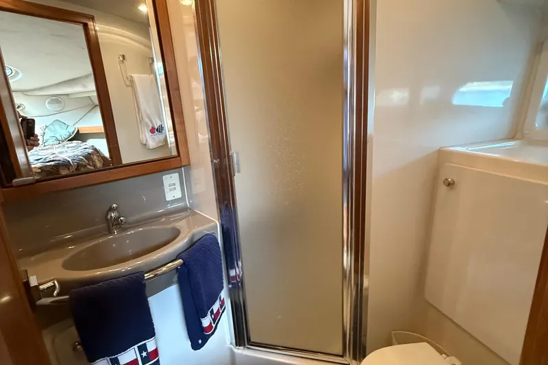 Slide: The Image of Bathroom interior of 1999 Bayliner 3788 Command Bridge Motoryacht with sink and shower. - 42