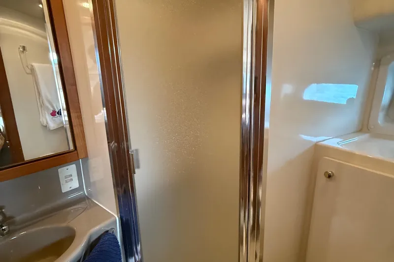 Slide: The Image of Bathroom interior of 1999 Bayliner 3788 Command Bridge Motoryacht with shower and sink. - 43