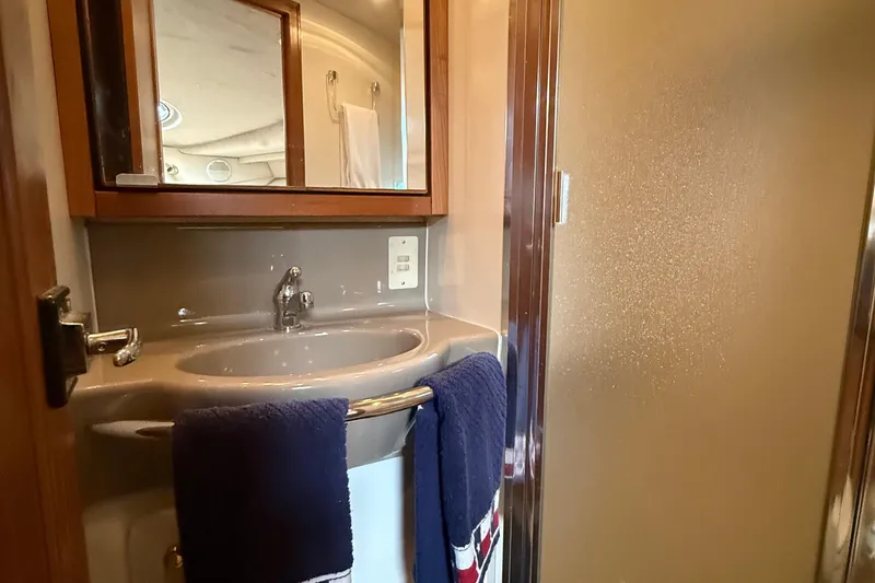 Slide: The Image of Bathroom interior of 1999 Bayliner 3788 Command Bridge Motoryacht with sink and mirror. - 44