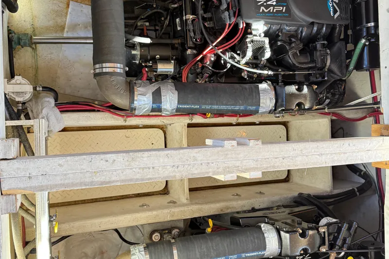 Slide: The Image of Engine compartment of 1999 Bayliner 3788 Command Bridge Motoryacht, featuring 7.4L MPI engine. - 45