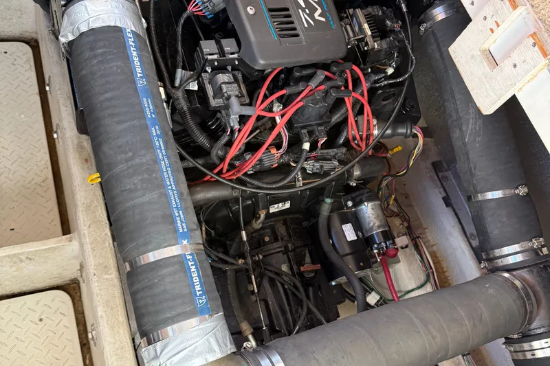 Slide: The Image of Engine compartment of a 1999 Bayliner 3788 Command Bridge Motoryacht with visible wiring and components. - 47