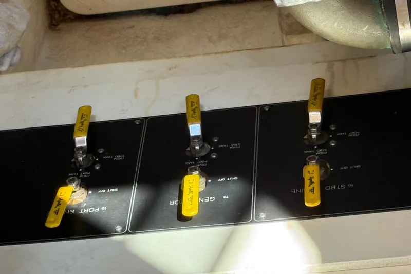 Slide: The Image of Control panel with yellow levers on a 1999 Bayliner 3788 Command Bridge Motoryacht. - 48